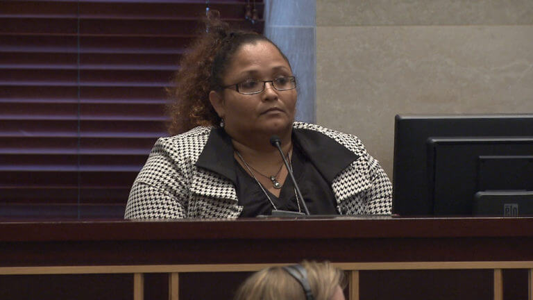 A woman testifies in court