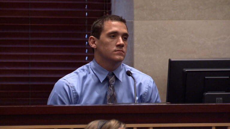 A man in a tie testifies in court