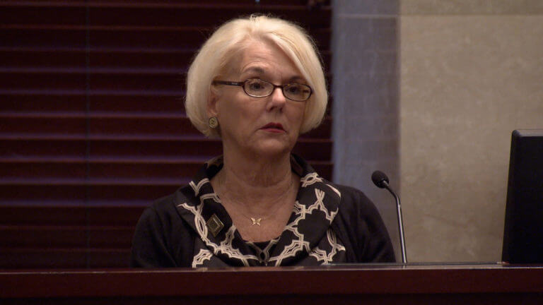 A woman testifies in court