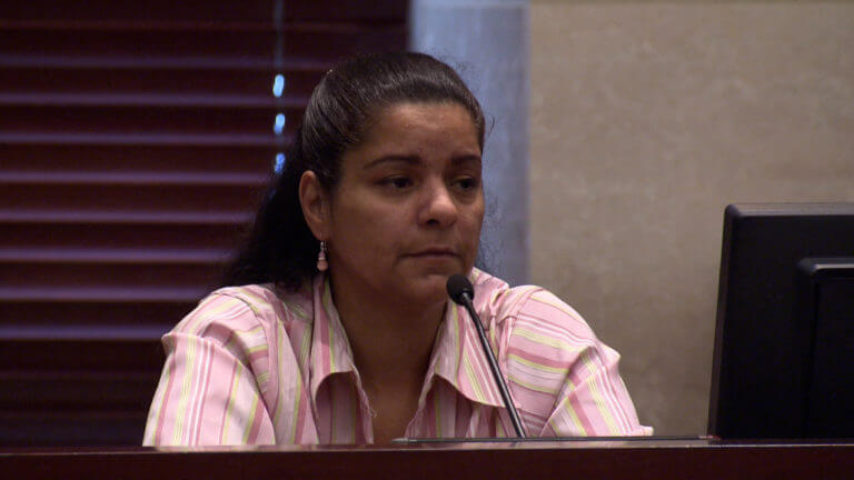 A woman testifies in court