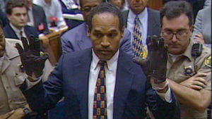 OJ Simpson tries on leather gloves during his double murder trial