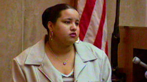 A woman testifies in court