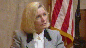 A woman testifies in court.