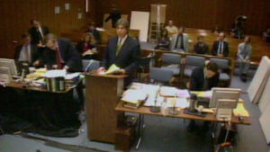 An attorney addresses the court from a podium