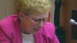 A woman testifies in court