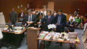 Attorneys stand in court