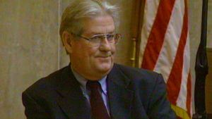 Dr. Bernard Carroll smiles in court