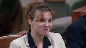 Sandy Murphy listens to testimony in her murder trial