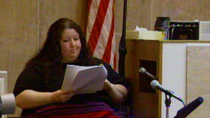 Donna Riley reads from a piece of paper in court