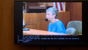 a woman appears in taped testimony