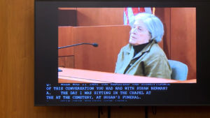 a woman appears in taped testimony