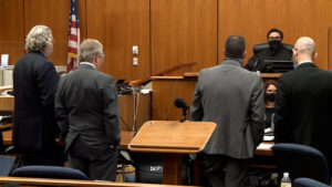 attorneys stand in court