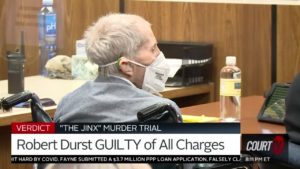 Robert Durst sits with a mask on in court