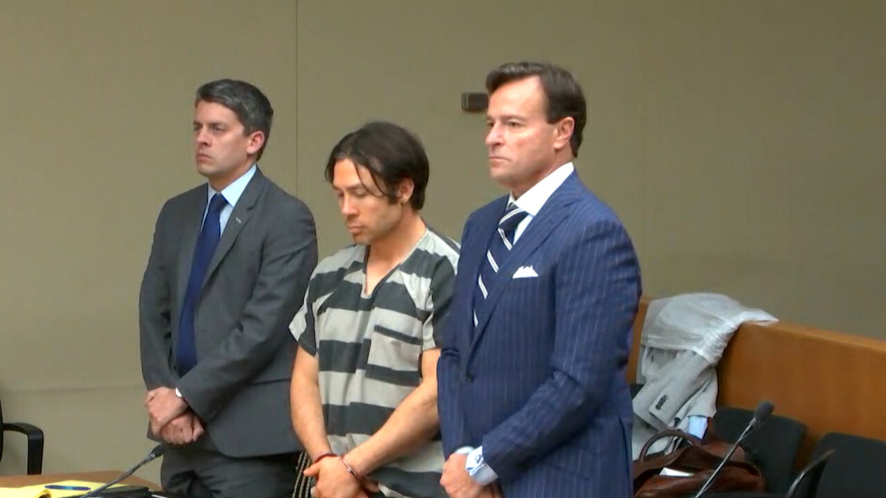 Geoffrey Paschel stands in court