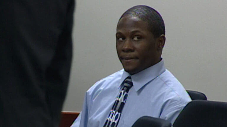 Derris Lewis listens to opening statements during his murder trial