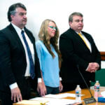 Lori Vallow Daybell, center, listens during a court hearing