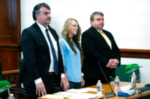 Lori Vallow Daybell, center, listens during a court hearing