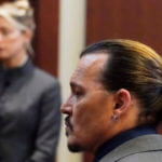 Actor Johnny Depp walks into the courtroom after a break at the Fairfax County Circuit Courthouse