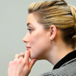 Actor Amber Heard listens in the courtroom