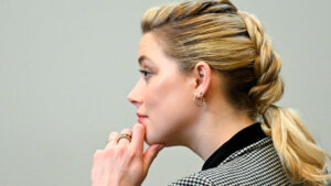 Actor Amber Heard listens in the courtroom