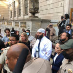 Adnan Syed, center, leaves the Elijah E. Cummings Courthouse