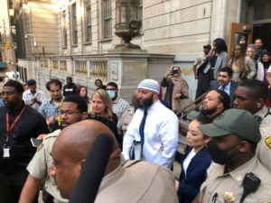 Adnan Syed, center, leaves the Elijah E. Cummings Courthouse