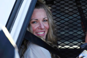 Lori Vallow Daybell sits in a police car