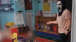 Daycare worker in 'Scream' mask.