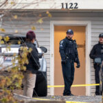 officers outside a house