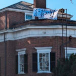 a banner outside of a house