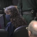 Sheila Keen-Warren speaks to her attorney during a hearing