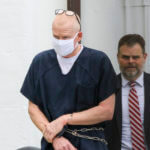 Alex Murdaugh is escorted out of the Colleton County Courthouse in Walterboro, S.C., on July 20, 2022.
