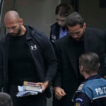 Andrew Tate and his brother Tristan are brought by police officers to the Court of Appeal, in Bucharest, Romania