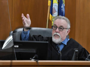 Judge gestures to courtroom in Mark Jensen's retrial on day 1 of jury selection.