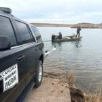 troopers search a pond near Cyril, Okla, on Wednesday, Jan. 11, 2023, for Athena Brownfield