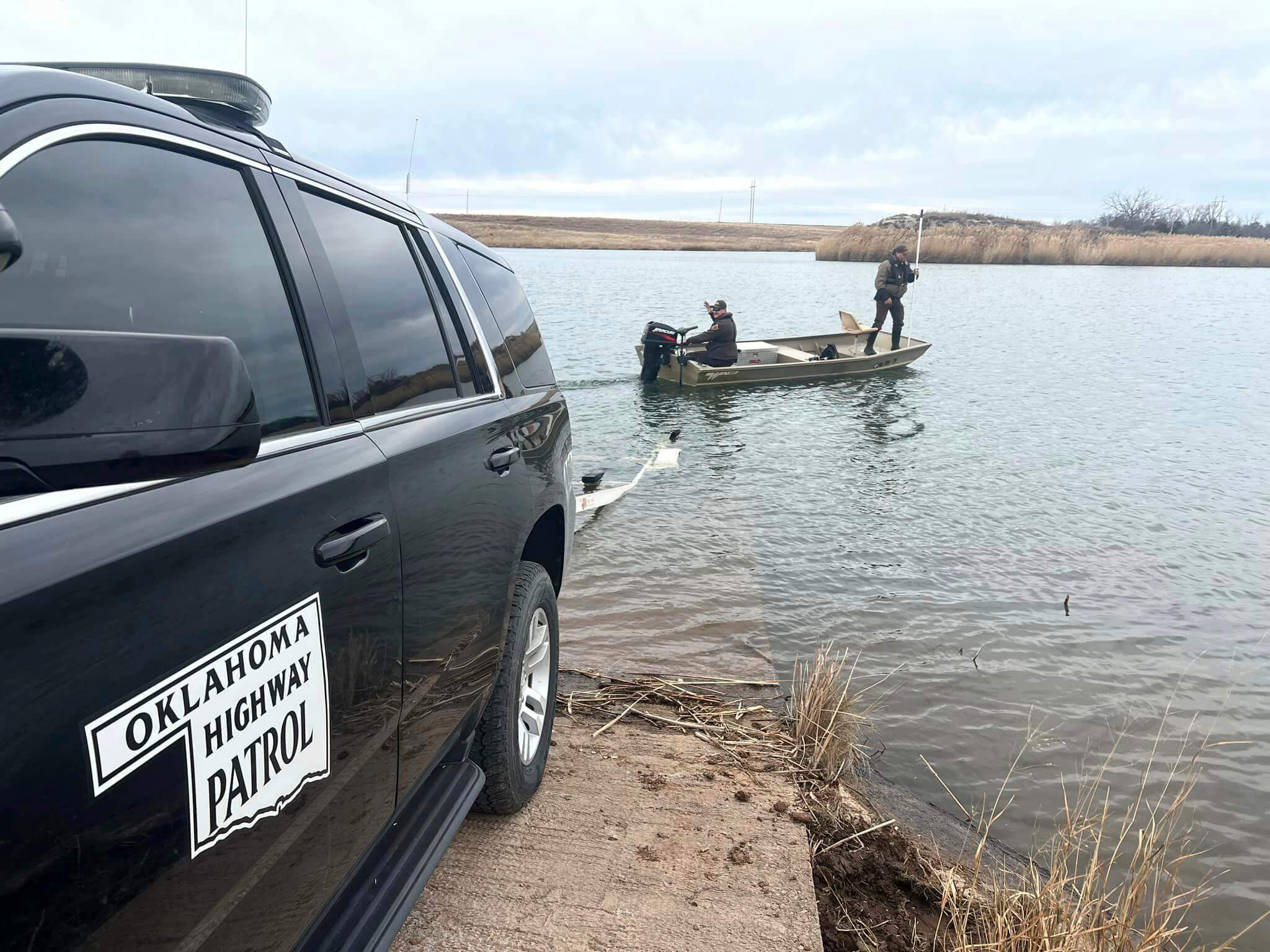 troopers search a pond near Cyril, Okla, on Wednesday, Jan. 11, 2023, for Athena Brownfield