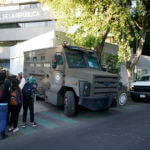 A heavily armed army convoy departs the prosecutor's building where Ovidio Guzmán is in custody