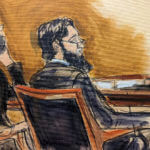 Sayfullo Saipov, right, is seated next to his defense attorney