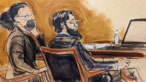 Sayfullo Saipov, right, is seated next to his defense attorney