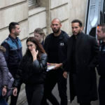 Andrew Tate and his brother Tristan are brought by police officers to the Court of Appeal, in Bucharest, Romania