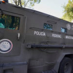 A heavily armed army convoy departs the prosecutor's building where Ovidio Guzmán is in custody