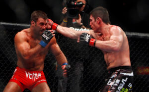 Amir Sadollah, right, punches Phil Baroni during their mma welterweight bout