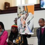 Family members and supporters hold a photograph of Tyre Nichols at a news conference in Memphis, Tenn., Jan. 23, 2023