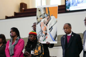 Family members and supporters hold a photograph of Tyre Nichols at a news conference in Memphis, Tenn., Jan. 23, 2023