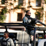 Security personnel guard the prosecutor's building where Ovidio Guzmán is in custody