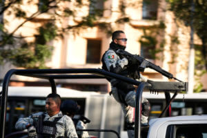 Security personnel guard the prosecutor's building where Ovidio Guzmán is in custody
