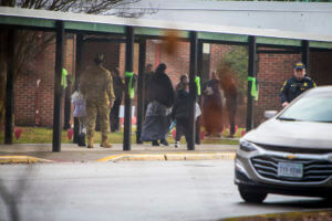 Parents escort their children Richneck Elementary School on Monday Jan. 30