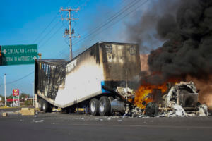 A truck burns on a street in Culiacan