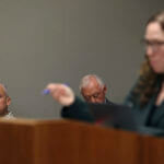 Innocence Project attorney Susan Freidman talks at the podium from the Albert 