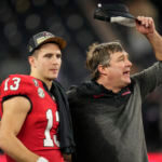 Georgia head coach Kirby Smart and Georgia quarterback Stetson Bennett (13) celebrate victory over TCU